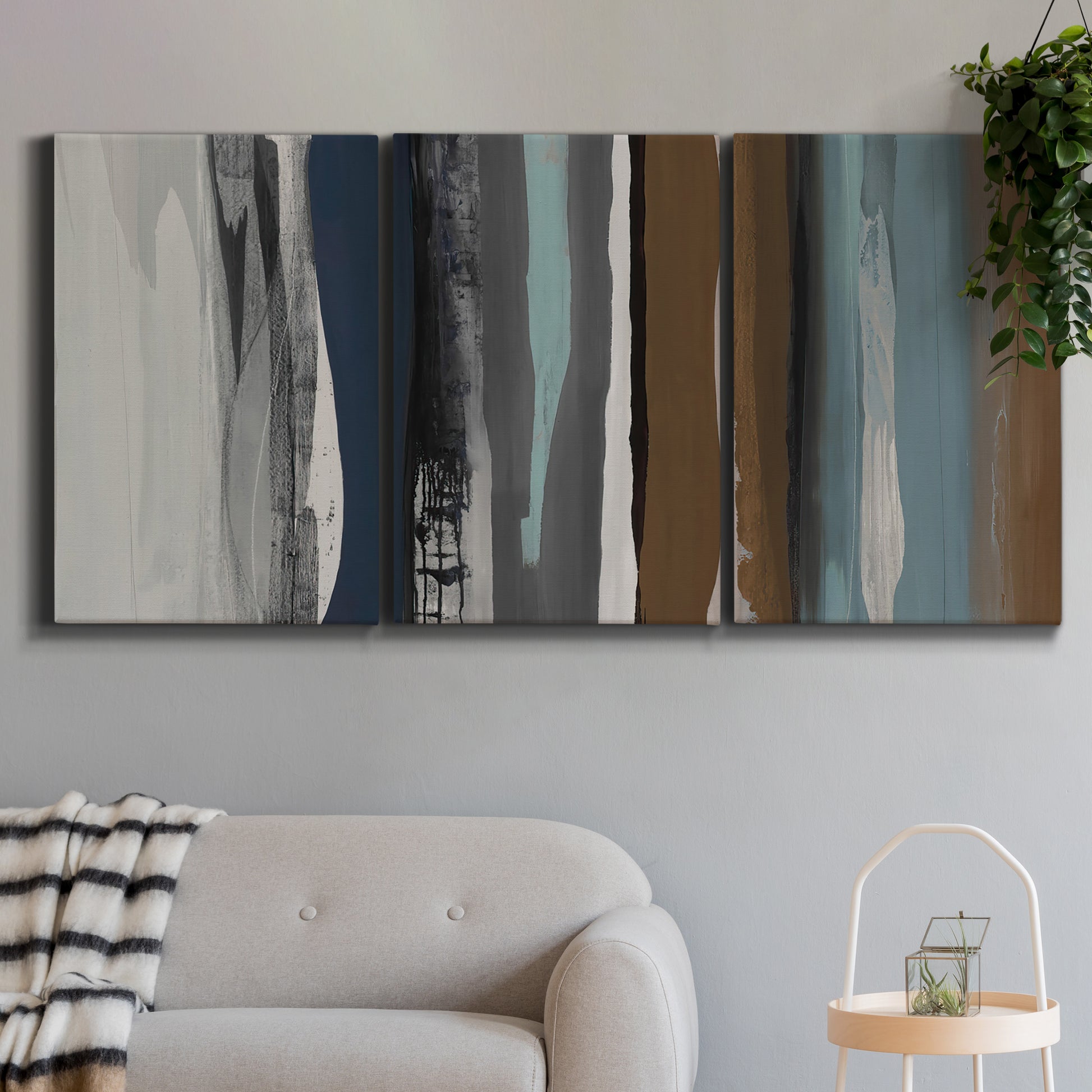 Three-panel canvas wall art featuring layered abstract amusement park tones, displayed in a modern living room above a sofa.
