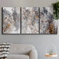 Three-panel canvas wall art featuring wooded trail through forest, displayed in a modern living room above a sofa.
