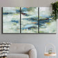 Three-panel canvas wall art featuring dreamlike abstract drifting motion, displayed in a modern living room above a sofa.