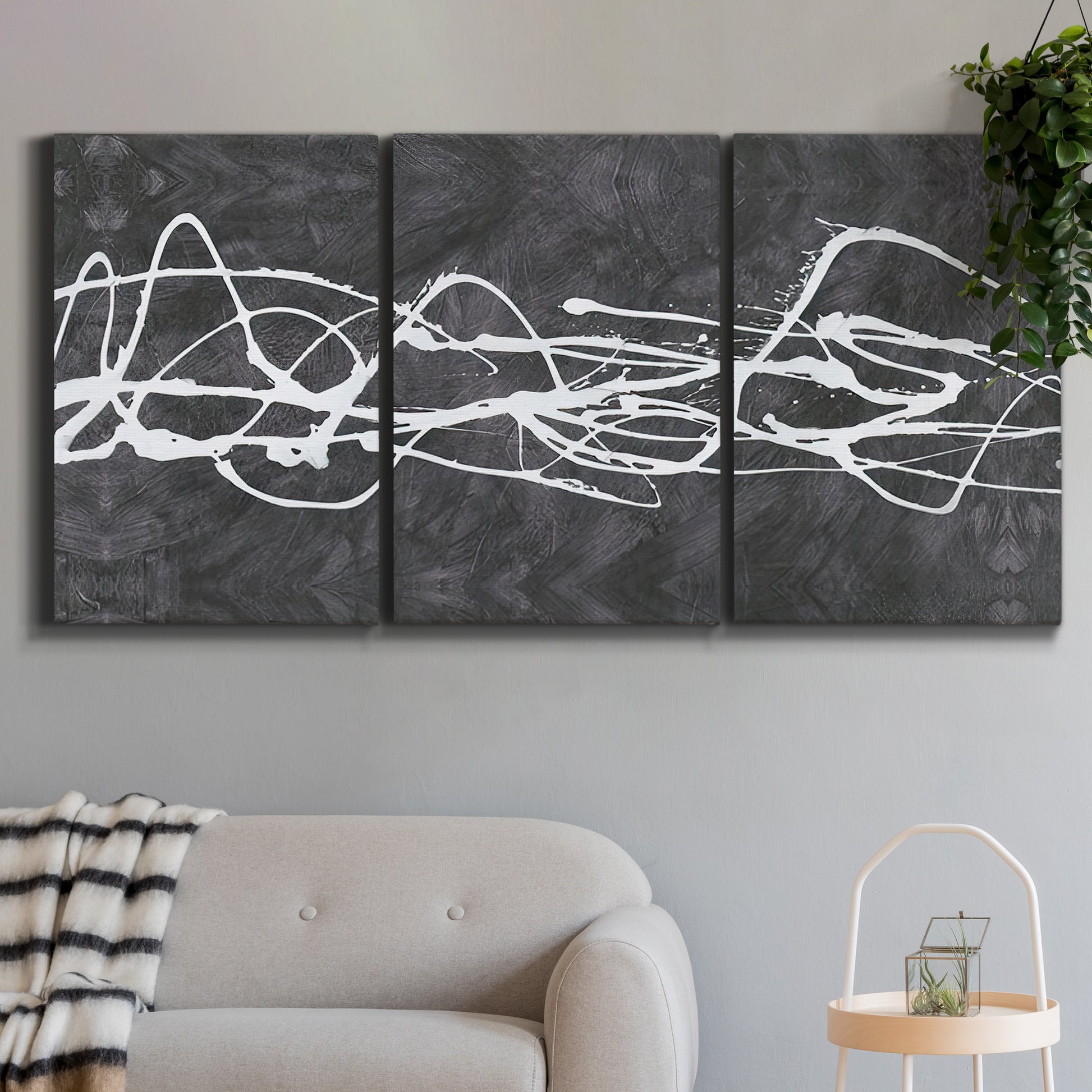 Three-panel canvas wall art featuring minimal abstract frequency lines, displayed in a modern living room above a sofa.