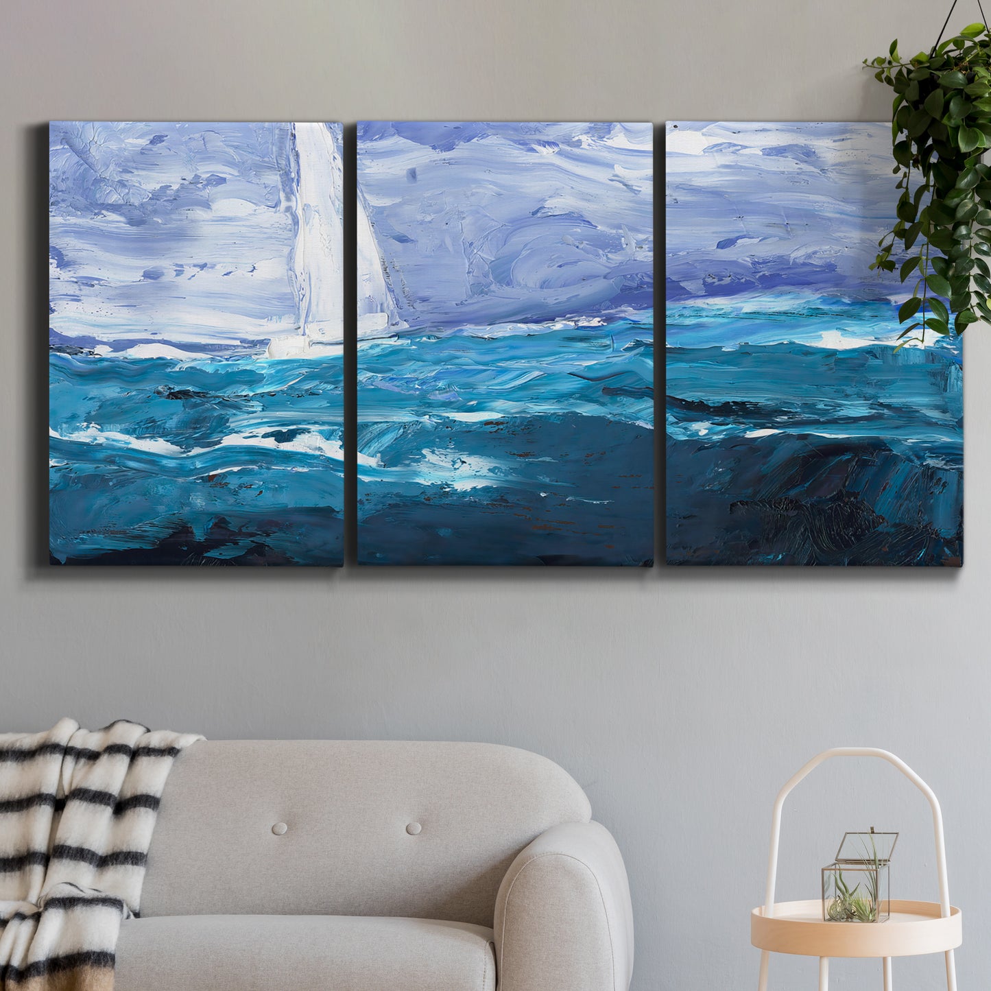 Three-panel canvas wall art featuring impressionist nautical harbor scene, displayed in a modern living room above a sofa.