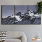 Three-panel canvas wall art featuring moonlit mountain peaks under night sky, displayed in a modern living room above a sofa.