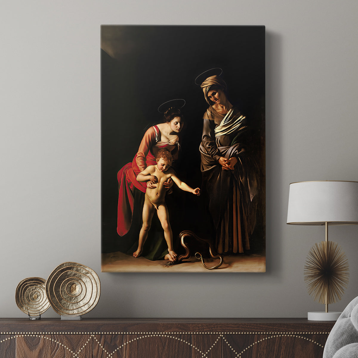 Canvas art print featuring a devotional scene with gentle expressions and warm tones displayed in a modern interior space.