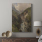 Canvas art print featuring a natural scene with flowing water and towering cliffs displayed in a modern interior space.