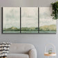 Three-panel canvas wall art featuring riverbank landscape with trees, displayed in a modern living room above a sofa.