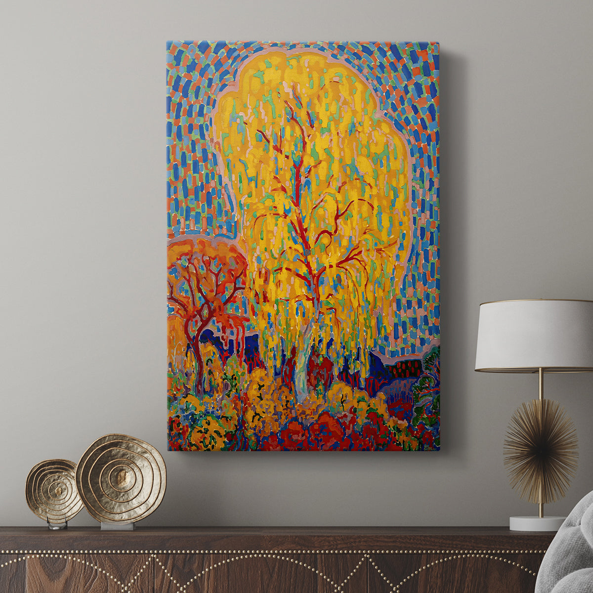 Canvas art print featuring a vivid composition with a central tree and bright palette displayed in a modern interior space.