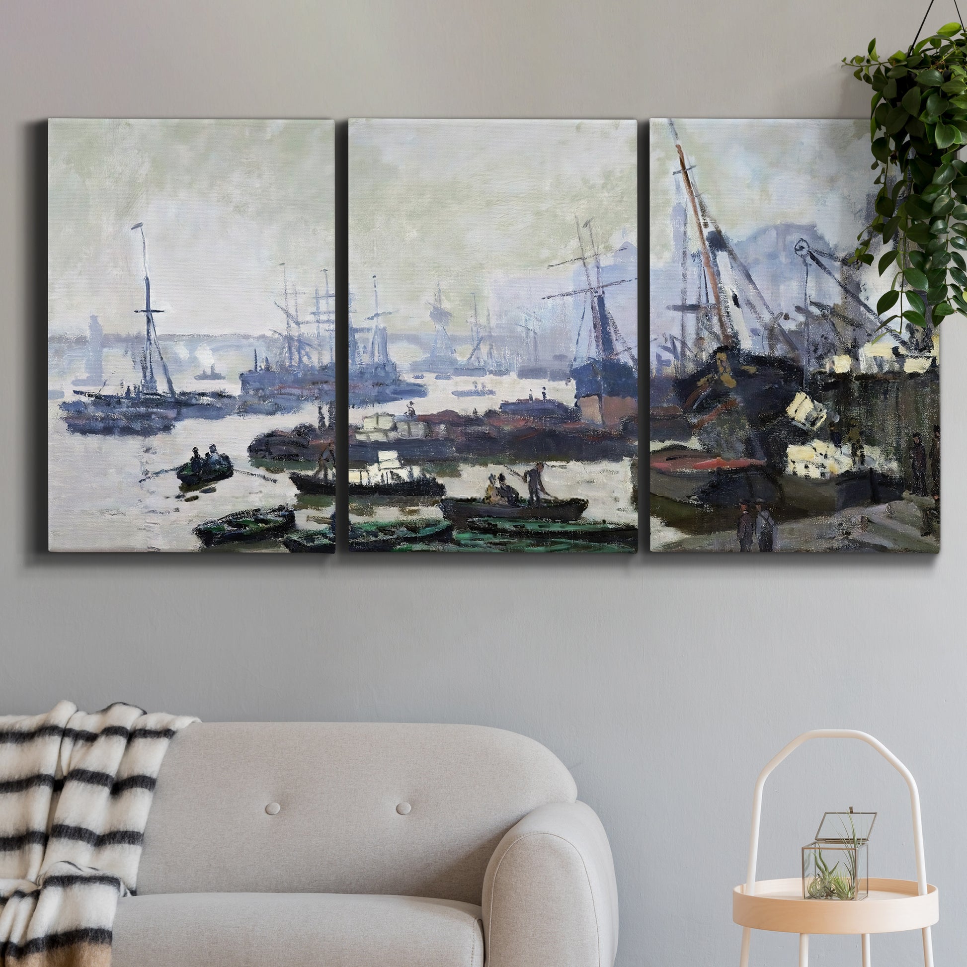 Three-panel canvas wall art featuring working harbor with docked boats, displayed in a modern living room above a sofa.