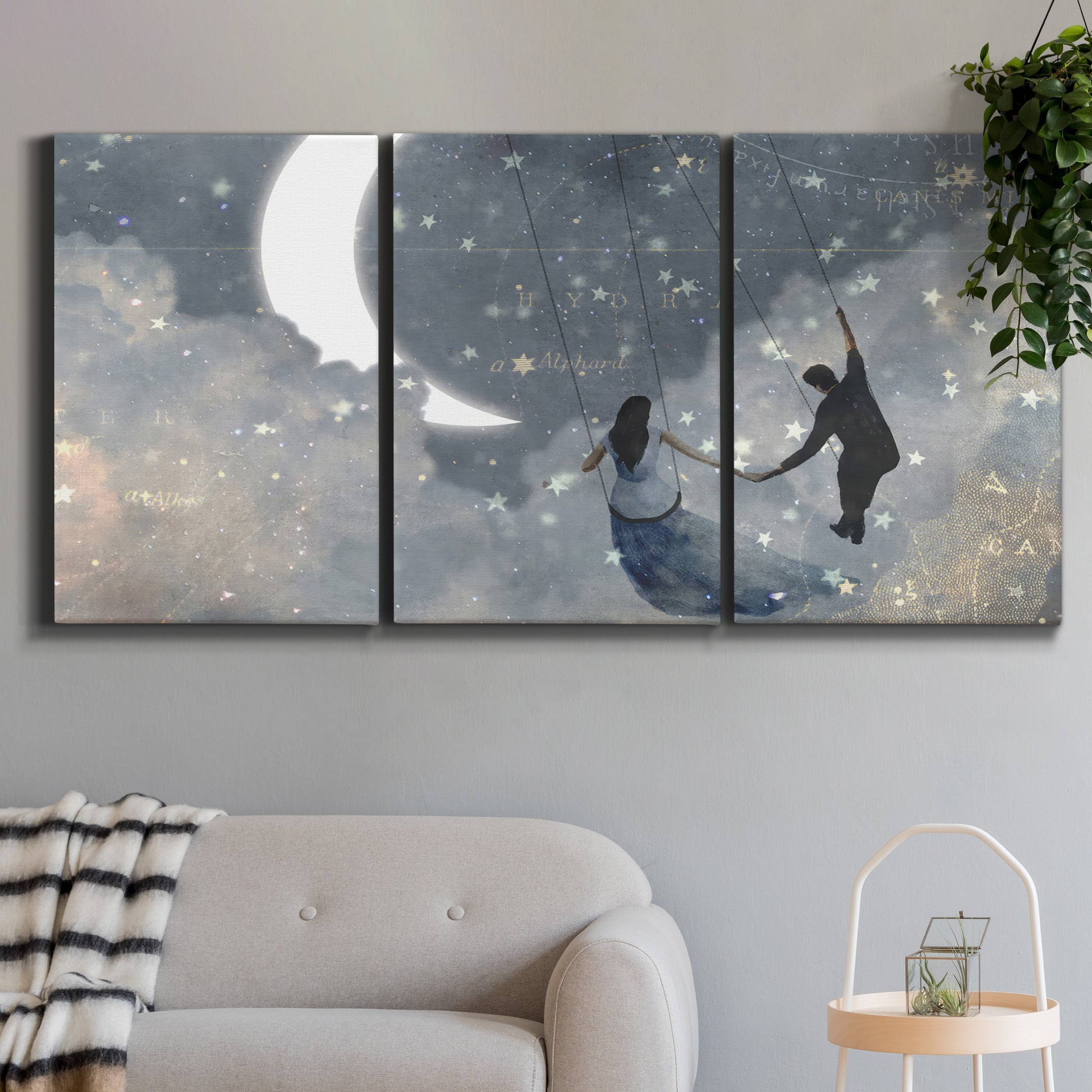 Three-panel canvas wall art featuring surreal celestial romantic scene, displayed in a modern living room above a sofa.