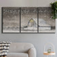 Three-panel canvas wall art featuring rustic winter holiday text art, displayed in a modern living room above a sofa.