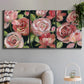 Three-panel canvas wall art featuring bold red floral abstraction, displayed in a modern living room above a sofa.