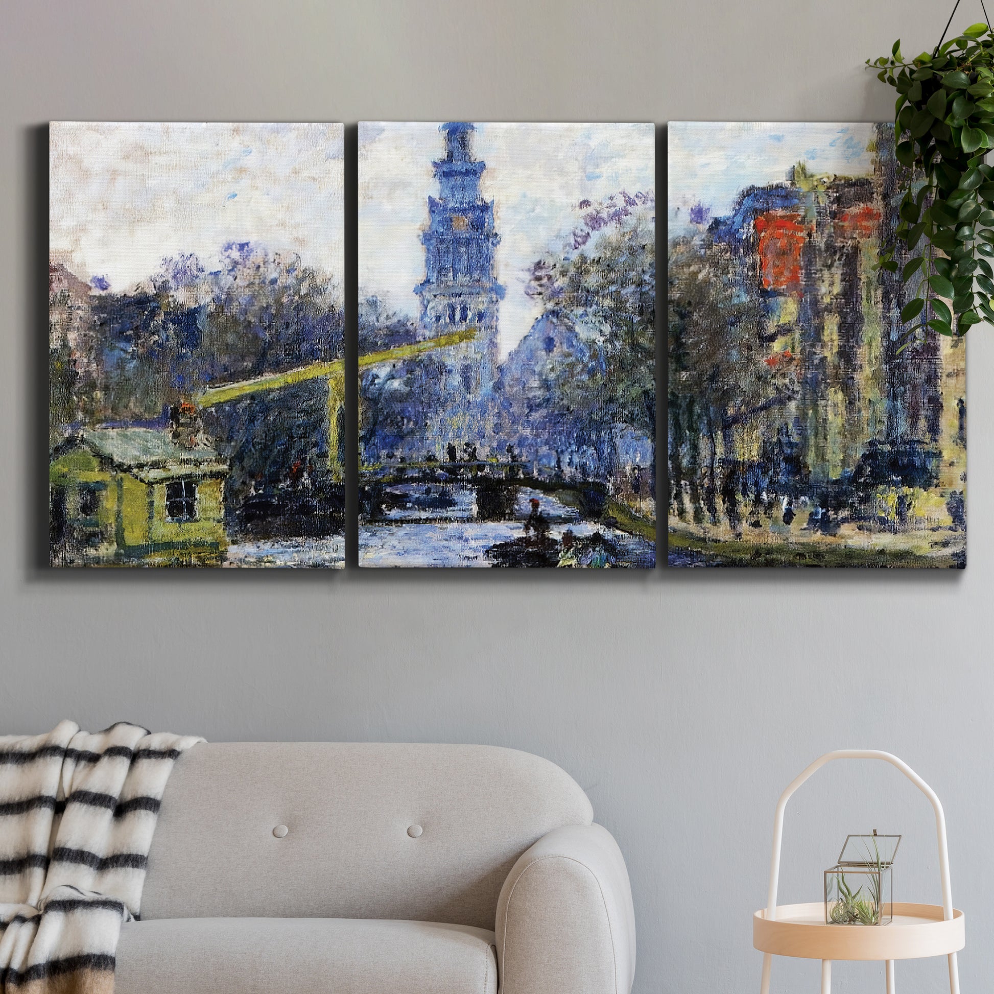Three-panel canvas wall art featuring historic tower beside canal, displayed in a modern living room above a sofa.