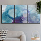 Three-panel canvas wall art featuring icy abstract crystalline forms, displayed in a modern living room above a sofa.