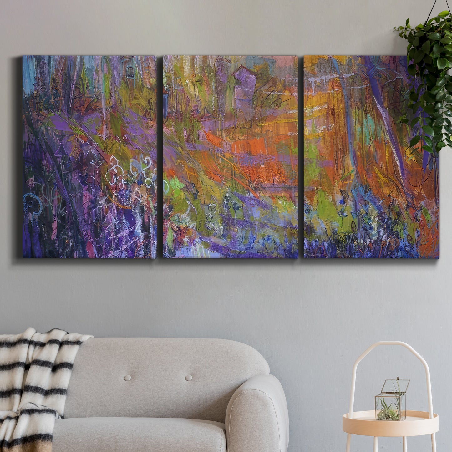 Three-panel canvas wall art featuring abstract rainfall with butterfly forms, displayed in a modern living room above a sofa.
