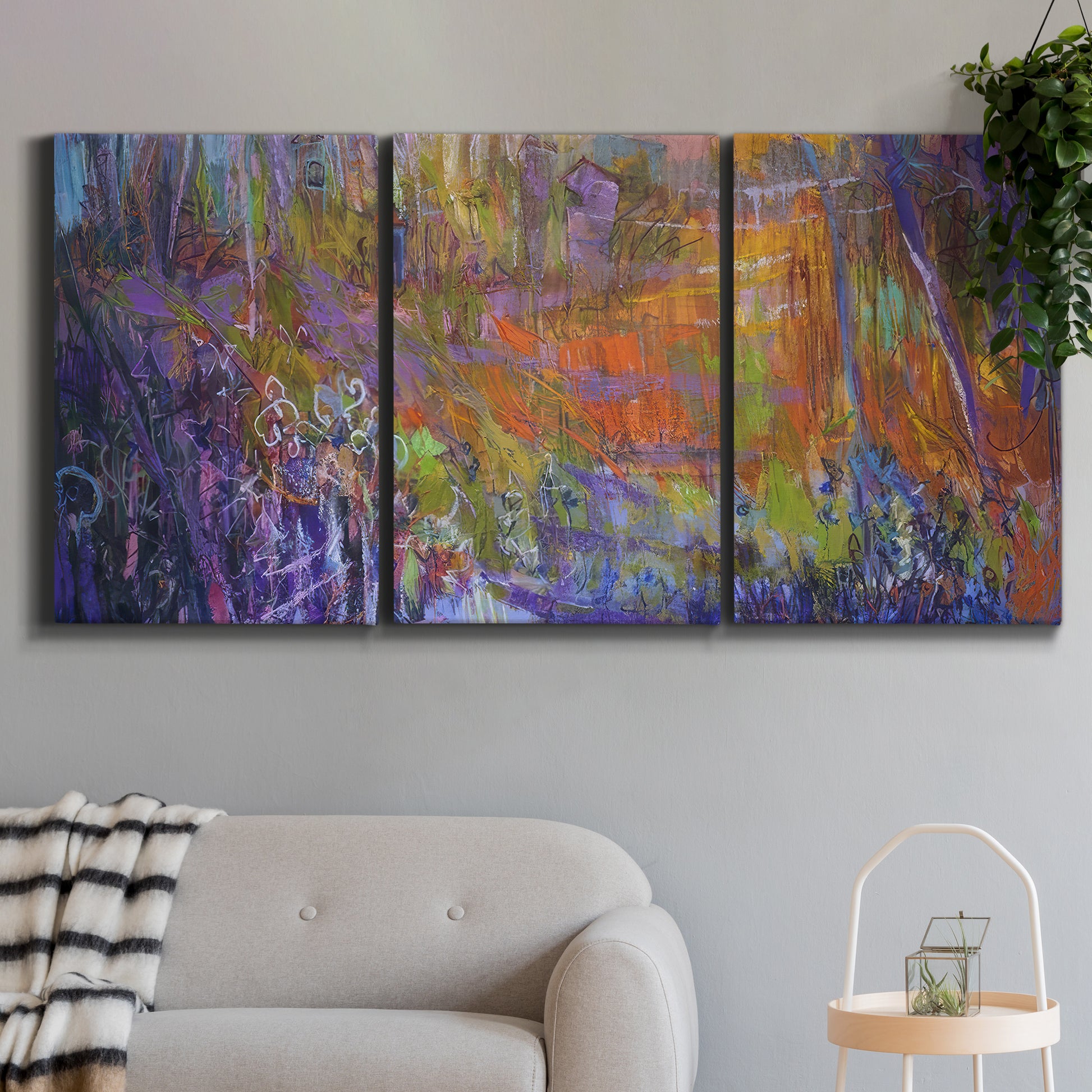 Three-panel canvas wall art featuring abstract rainfall with butterfly forms, displayed in a modern living room above a sofa.