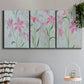 Three-panel canvas wall art featuring pink floral trio arrangement, displayed in a modern living room above a sofa.