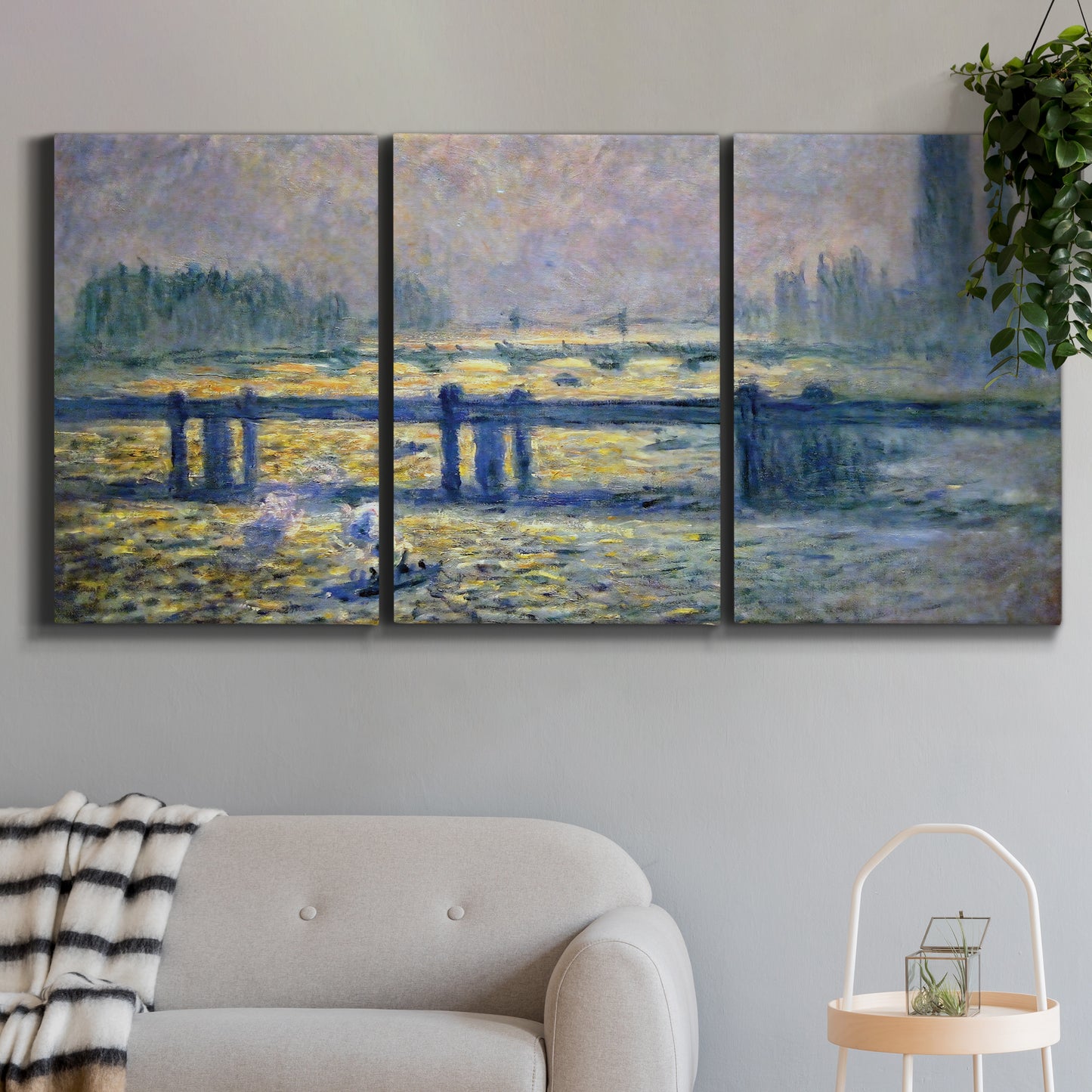 Three-panel canvas wall art featuring london bridge crossing wide river, displayed in a modern living room above a sofa.
