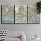 Three-panel canvas wall art featuring abstract river reflections, displayed in a modern living room above a sofa.