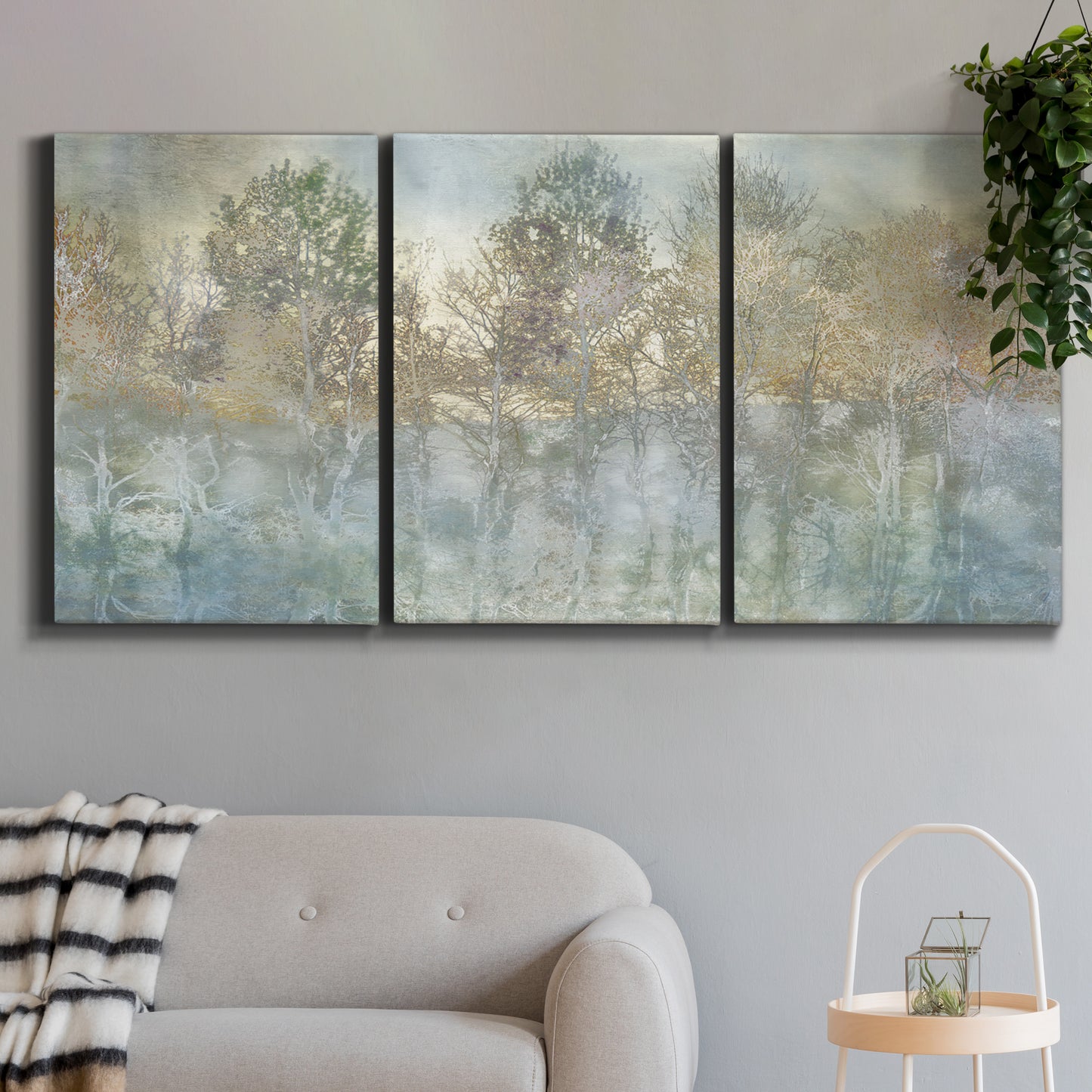 Three-panel canvas wall art featuring abstract river reflections, displayed in a modern living room above a sofa.