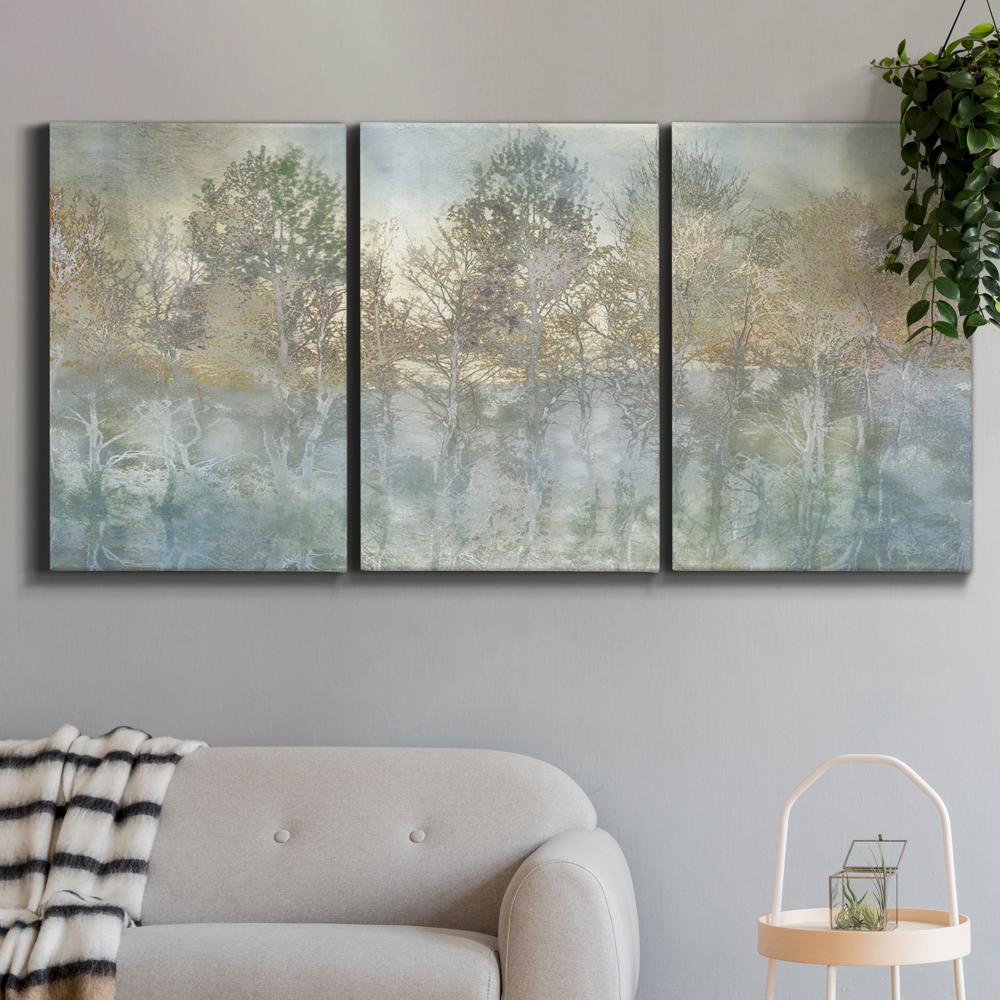 Three-panel canvas wall art featuring abstract river reflections, displayed in a modern living room above a sofa.