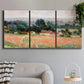 Three-panel canvas wall art featuring haystacks arranged in rural field, displayed in a modern living room above a sofa.
