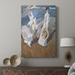 Canvas art print featuring a luminous seaside scene with figures in motion displayed in a modern interior space.