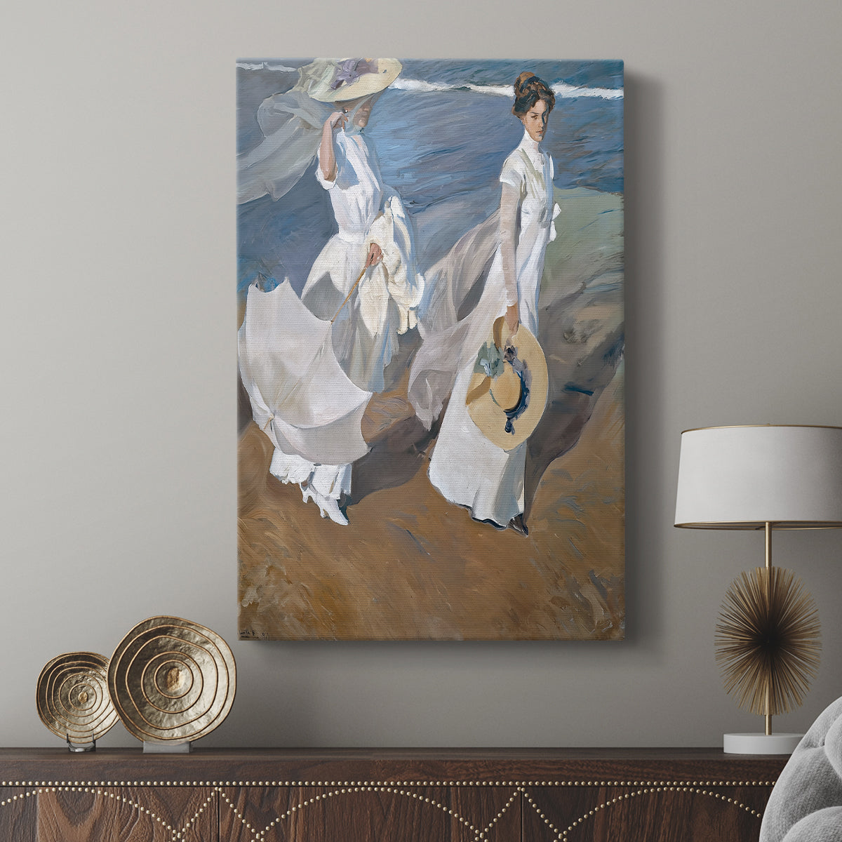 Canvas art print featuring a luminous seaside scene with figures in motion displayed in a modern interior space.
