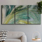 Three-panel canvas wall art featuring layered modern abstract landscape, displayed in a modern living room above a sofa.