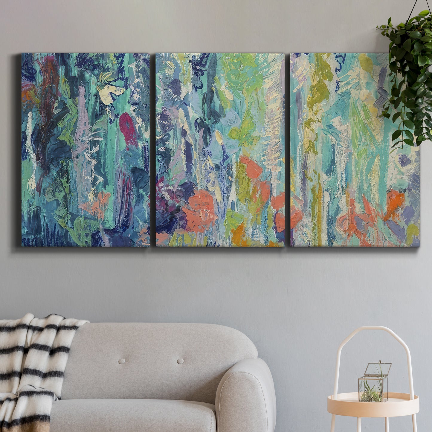 Three-panel canvas wall art featuring abstract rainfall with butterfly forms, displayed in a modern living room above a sofa.
