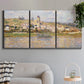 Three-panel canvas wall art featuring village overlooking river valley, displayed in a modern living room above a sofa.