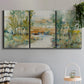 Three-panel canvas wall art featuring trees lining quiet creek, displayed in a modern living room above a sofa.