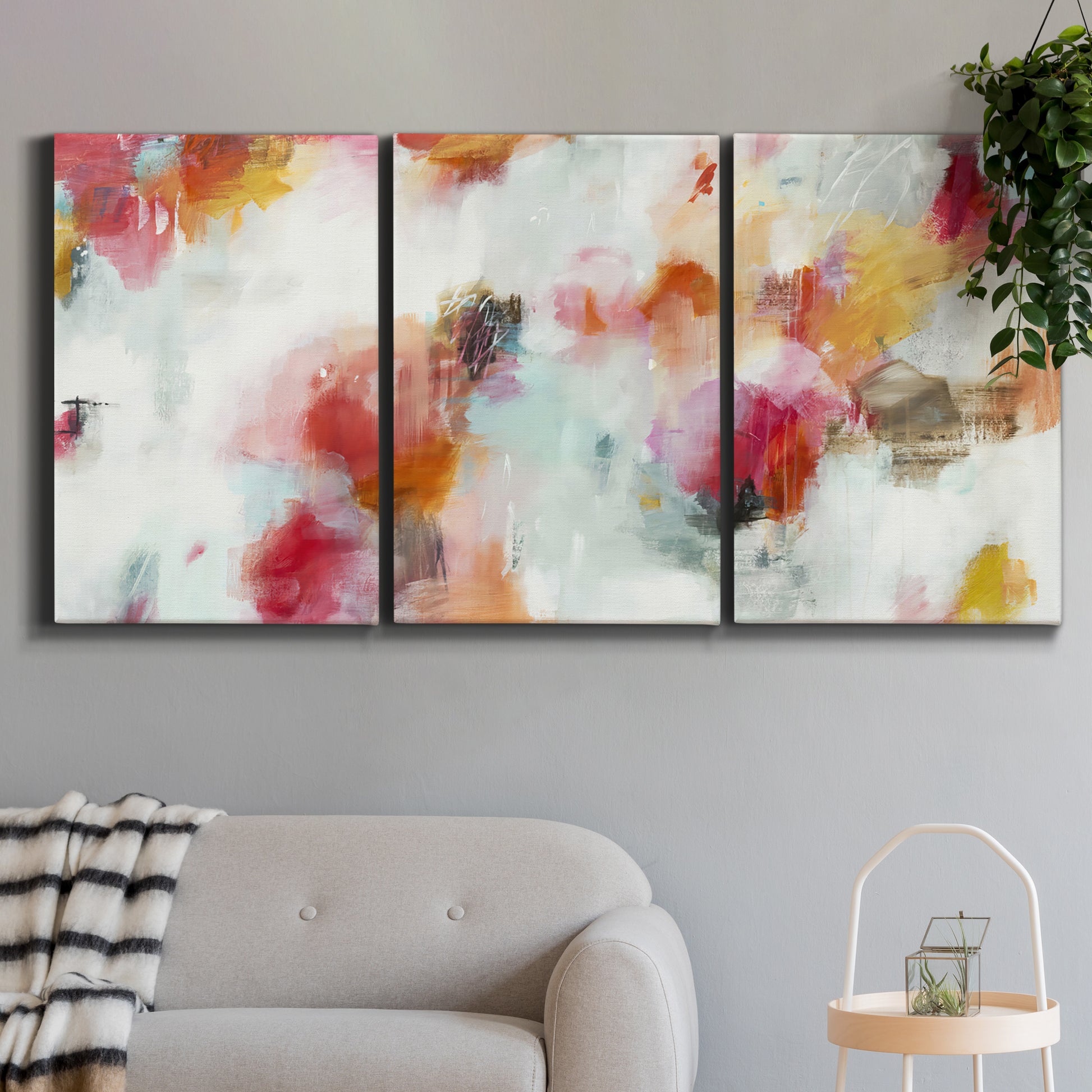 Three-panel canvas wall art featuring abstract directional visual shift, displayed in a modern living room above a sofa.