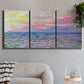 Three-panel canvas wall art featuring sunset reflections across calm sea, displayed in a modern living room above a sofa.