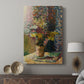 Canvas art print featuring a decorative composition with blossoms and vivid palette displayed in a modern interior space.