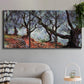 Three-panel canvas wall art featuring pine trees silhouetted at evening, displayed in a modern living room above a sofa.