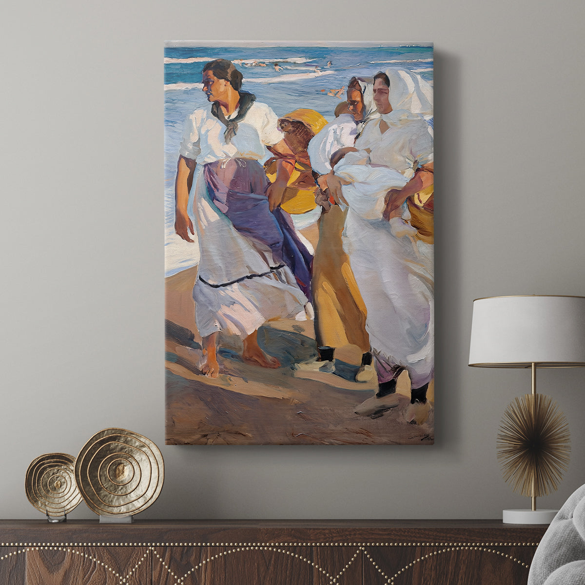 Canvas art print featuring a lively seaside scene with flowing garments and wind displayed in a modern interior space.