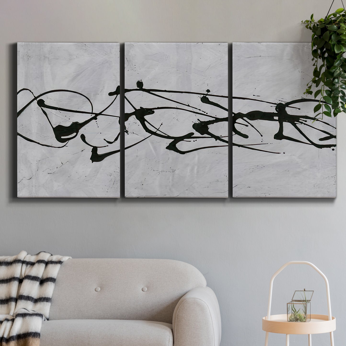 Three-panel canvas wall art featuring minimal abstract frequency lines, displayed in a modern living room above a sofa.