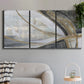 Three-panel canvas wall art featuring spiraling abstract vortex motion, displayed in a modern living room above a sofa.