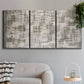 Three-panel canvas wall art featuring grid based geometric abstraction, displayed in a modern living room above a sofa.