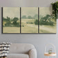 Three-panel canvas wall art featuring pasture landscape in soft watercolor, displayed in a modern living room above a sofa.