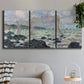 Three-panel canvas wall art featuring rough seas along rocky coast, displayed in a modern living room above a sofa.