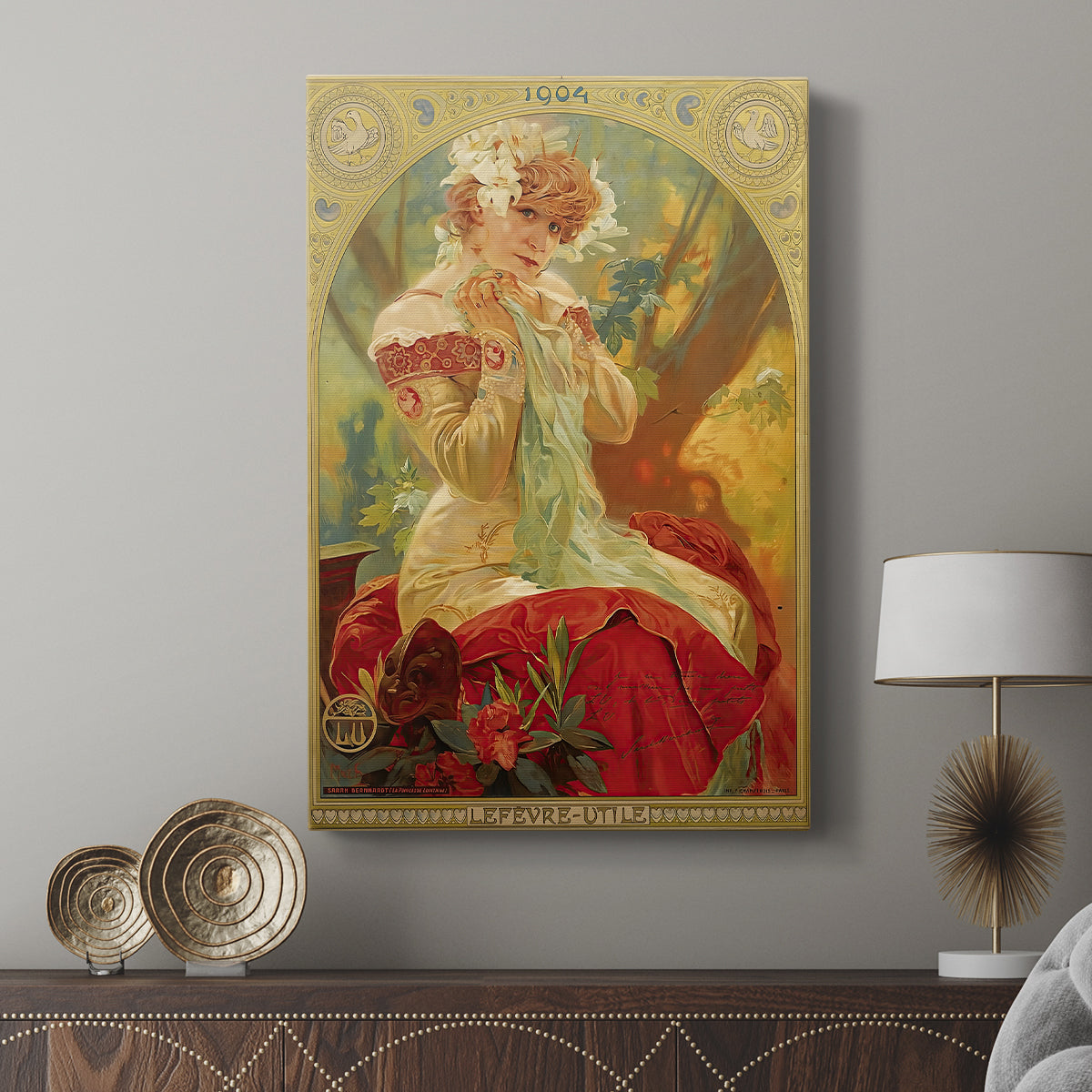 Canvas art print featuring a decorative figure framed by intricate patterns displayed in a modern interior space.