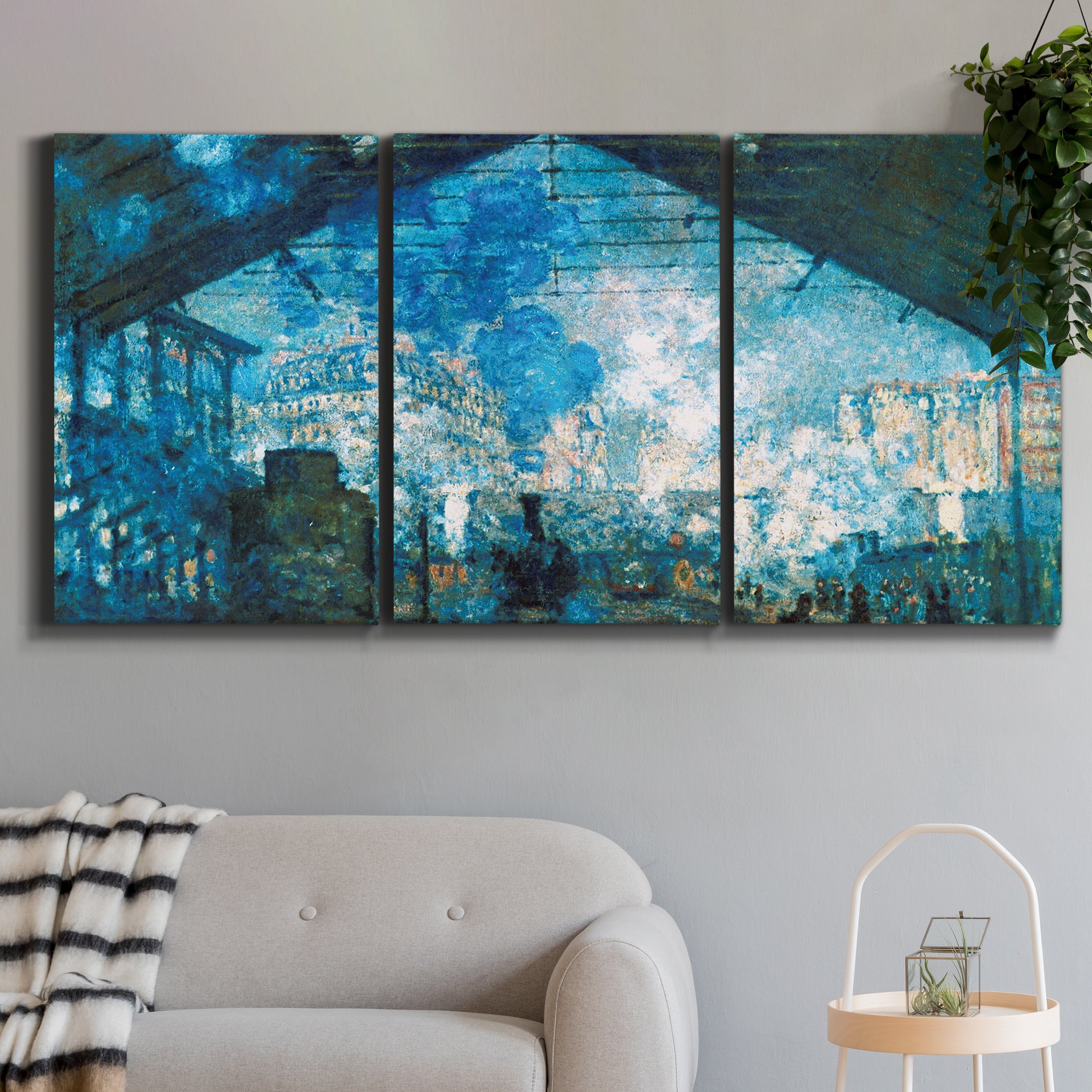 Three-panel canvas wall art featuring railway station filled with steam, displayed in a modern living room above a sofa.