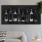Three-panel canvas wall art featuring illustrated wine bottle cellar diagram, displayed in a modern living room above a sofa.
