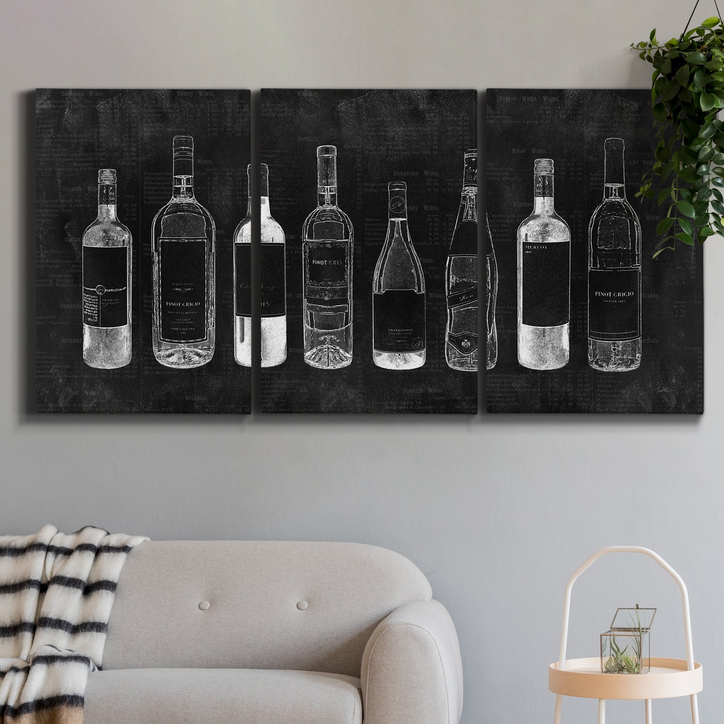 Three-panel canvas wall art featuring illustrated wine bottle cellar diagram, displayed in a modern living room above a sofa.