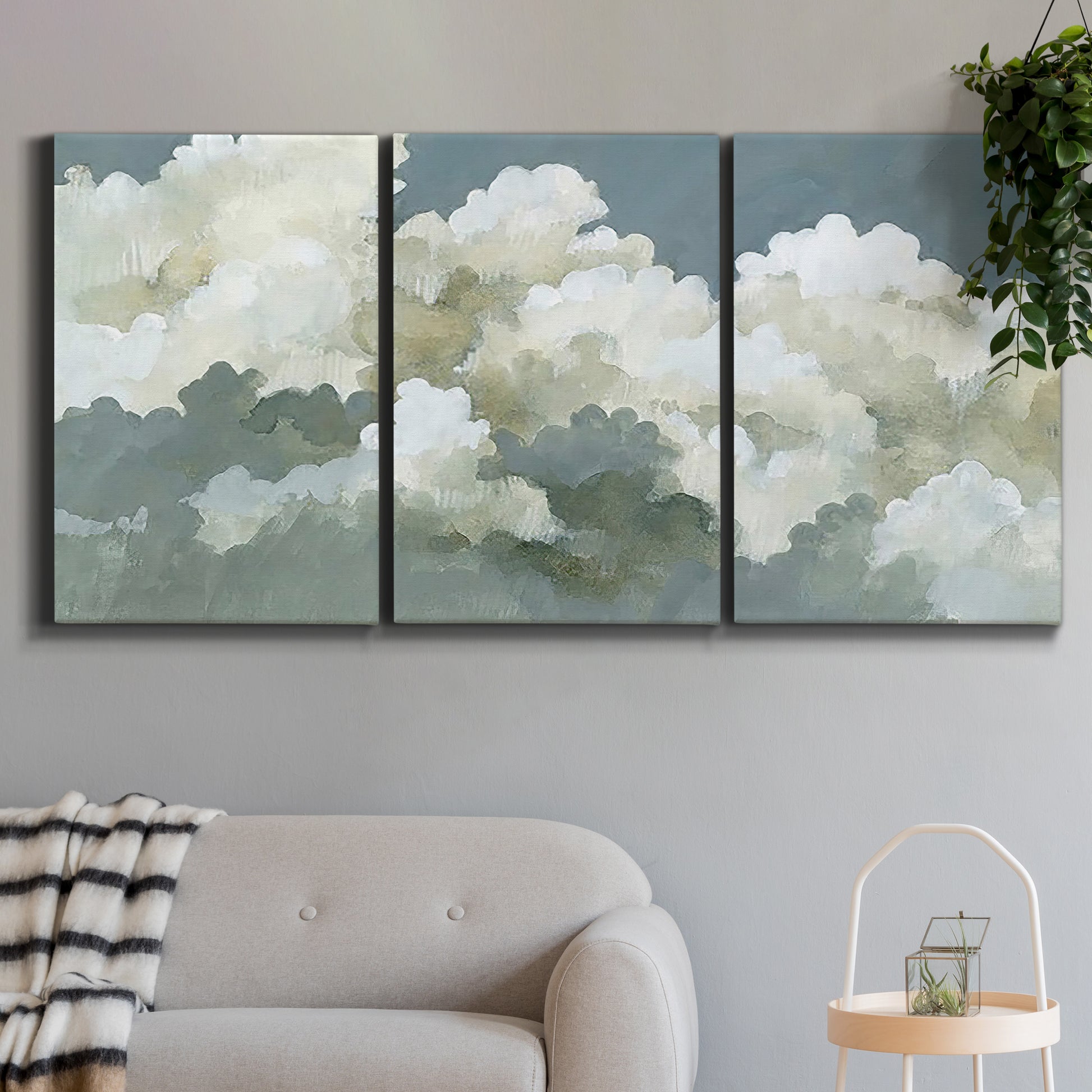 Three-panel canvas wall art featuring abstract evening landscape with depth, displayed in a modern living room above a sofa.