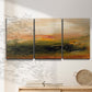 Three-panel canvas wall art featuring soft abstract evening light, displayed in a minimalist living room above a console table.