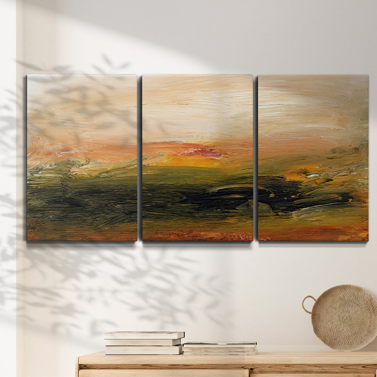 Three-panel canvas wall art featuring soft abstract evening light, displayed in a minimalist living room above a console table.