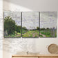 Three-panel canvas wall art featuring spring landscape with blossoming trees, displayed in a minimalist living room above a console table.
