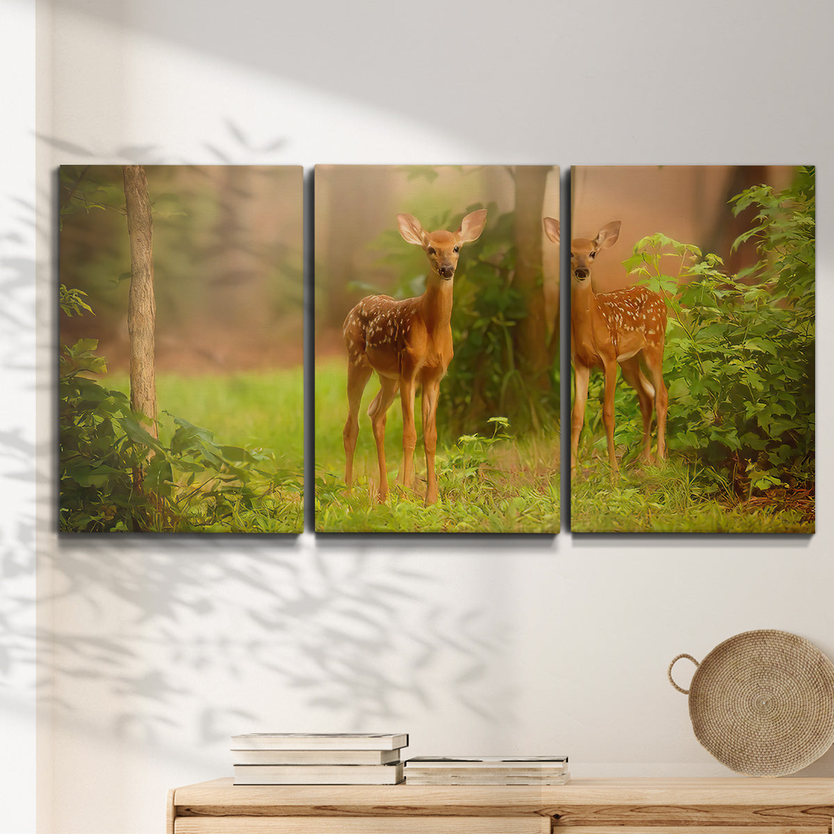 Three-panel canvas wall art featuring resting animals in open field, displayed in a minimalist living room above a console table.