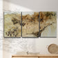 Three-panel canvas wall art featuring muted abstract with metallic gold accents, displayed in a minimalist living room above a console table.